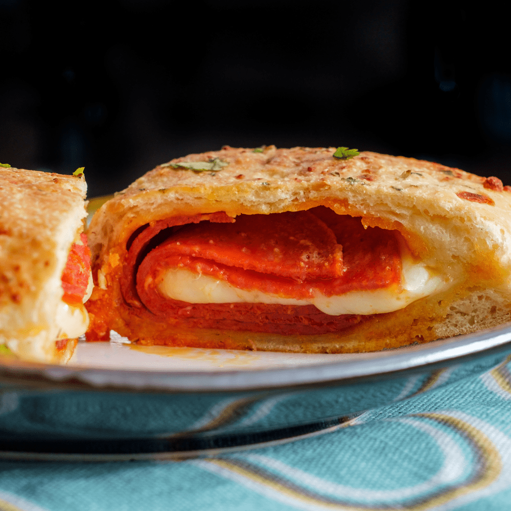 Veggie, Chicken, Beef, or Pepperoni Calzone served by Veggie, Chicken, Beef, or Pepperoni Calzone - Pink Pony